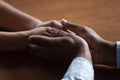 Close up of biracial couple hold hands having romantic moment Royalty Free Stock Photo