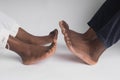 Close up African American man and woman legs touching holding together isolated on white background for love and healing