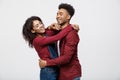 Close-up of African American young couple deny kissing over white background studio Royalty Free Stock Photo