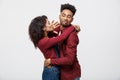 Close-up of African American young couple deny kissing over white background studio Royalty Free Stock Photo