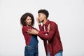 Close-up of African American young couple deny kissing over white background studio Royalty Free Stock Photo