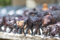 Close up of African Animals carved from wood in an open air market