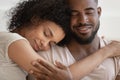 Close up african couple embracing closed eyes enjoy tender moment Royalty Free Stock Photo