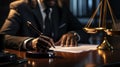 Close-up of african male lawyer sitting at table and working with documents