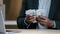 Close up African old male hands with money in office unrecognizable biracial success wealthy businessman holding dollars Royalty Free Stock Photo