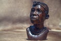 Close up of African traditional wooden Statue figurine on a fur background