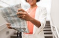 Close up of african woman reading newspaper