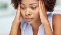 Close up of african young woman touching her head Royalty Free Stock Photo