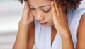 Close up of african young woman touching her head Royalty Free Stock Photo