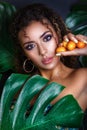 Close-up of afro american beautiful girl posing in tropical forest Royalty Free Stock Photo