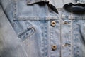 Close up aged denim texture. Old blue jeans jacket with stiched Royalty Free Stock Photo