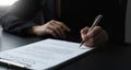 Close-up of the agreement document being signed. Business contract of young businesswoman Royalty Free Stock Photo