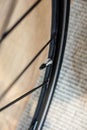 Close up of air valve stem on bicycle racing rims and tires