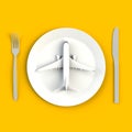 Close up of airplane on plate, knife and fork concept illustration on yellow background, Top view with copy space Royalty Free Stock Photo