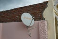 Close up of an Airtel dish installed on the roof of a house. view of Airtel Digital DTH Dish Antenna. Airtel Dish fixed at the top