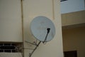 Close up of an Airtel dish installed on the roof of a house. view of Airtel Digital DTH Dish Antenna. Airtel Dish fixed at the top Royalty Free Stock Photo