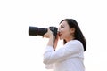 Close up Aisan Chinese woman photographer hold camera close to her face work in nature against blank background