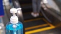 Close up alcohol gel sanitizer at the escalator for prevent the spread of pandemic Covid-19 and Coronavirus