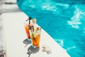 close-up of alcoholic drinks, ice and gin and tonic lemonade and mojito with lime served cold at pool bar Royalty Free Stock Photo