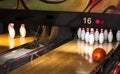 Close up of alley at bowling club. pin bowling alley background. Closeup of ten pin row on a lane, night light and sphere ball . Royalty Free Stock Photo