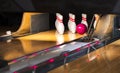 Close up of alley at bowling club. pin bowling alley background. Closeup of ten pin row on a lane, night light and sphere ball . Royalty Free Stock Photo