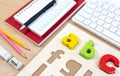 Close up of alphabet board game and basic equipment for elementary student.