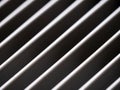 Close-up of aluminum cover grille with pattern of diagonal lines