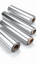 Close up of aluminum foil rolls on a white surface Royalty Free Stock Photo