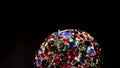 Close up of amazing luxury brooch with many colorful shiny gems. Concept. Rotating jewelry shining under spotlights