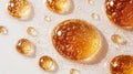 Close-up of amber liquid droplets with air bubbles on a white background Royalty Free Stock Photo