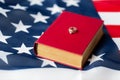 Close up of american flag, wedding rings and bible Royalty Free Stock Photo