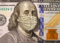 Close up American hundred dollar bill and Benjamin Franklin wearing a medical mask stylized as an engraving Royalty Free Stock Photo