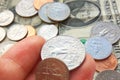 American quarter, dime coins in hand on dollar usa background Royalty Free Stock Photo