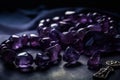 A close-up of amethyst gemstones, necklace or bracelet, with a focus on the unique and deep purple color. Concept luxury and