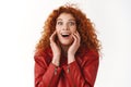Close-up amused happy cheerful ginger girl curly hairstyle smiling pleased amazed reacting awesome good news touch