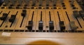 Close-up Of An Analog Audio Mixer, Featuring Faders, Knobs, And Channel Strips