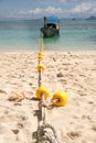 Close up Anchor rope anchor and boat in the beach