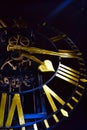 Close-up of ancient dark skeleton clock with golden hands and roman numerals Royalty Free Stock Photo