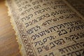 Close-up of ancient hebrew manuscript with old script on aged paper Royalty Free Stock Photo