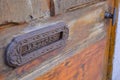 Ancient wooden door with letter box