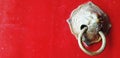 Close up ancient lion head door knocker decorate on red wooden door in Chinese style at temple with copy space Royalty Free Stock Photo