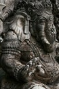 Close-up of an ancient sculpture in Indonesia on the island of Bali. Grey stone sculpture in the old town. Ganesh.