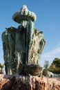 Close up of ancient stone, limestone fountain with frog in front. Located in the garden of an old fairy-tale castle. Royalty Free Stock Photo