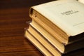 Close up of Ancient Textbooks and Research Notes on a Wooden Table A close up shot focusing on a stack Royalty Free Stock Photo