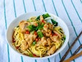 Close-up angle view noodles with chicken in a bolw, asian street food Royalty Free Stock Photo
