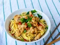 Close-up angle view noodles with chicken in a bolw, asian street food