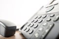 Close up angled view of a black landline telephone with a number Royalty Free Stock Photo