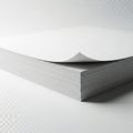 Stack of white paper showing a single sheet being peeled back from the top isolated on white background Royalty Free Stock Photo