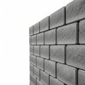 Stacked Grey Concrete Interlocking Paving Blocks Forming a Wall Section on White Background Royalty Free Stock Photo