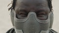 Close up, angry african american black man with mask over his face ready for fight Royalty Free Stock Photo